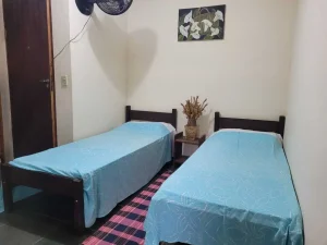 Cama em suíte compartilhada com uma pessoa